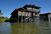 Inle Lake Myanmar. All the buildings are constructed on piles. Residents travel around by canoe, but there are also bamboo walkways and bridges over the canals, monasteries and stupas. 